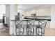 Breakfast bar with three gray counter stools at 7521 Ridgelake Cir, Bradenton, FL 34203