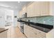 Modern kitchen with stainless steel appliances and granite countertops at 7521 Ridgelake Cir, Bradenton, FL 34203