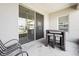 Cozy patio with wicker furniture and sliding glass door at 7521 Ridgelake Cir, Bradenton, FL 34203