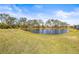 Serene pond view, lush green landscape at 7521 Ridgelake Cir, Bradenton, FL 34203