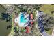 Community pool with lounge chairs and covered area at 7521 Ridgelake Cir, Bradenton, FL 34203