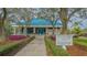 Tennis and fitness center with landscaping and signage at 7628 Whitebridge Gln, University Park, FL 34201