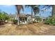 Private backyard with screened patio and lush landscaping at 7741 Whitebridge Gln, University Park, FL 34201