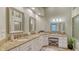 Elegant bathroom with double vanity, granite countertops, and large mirrors at 7741 Whitebridge Gln, University Park, FL 34201