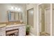 Modern bathroom featuring granite vanity and a walk-in shower at 7741 Whitebridge Gln, University Park, FL 34201