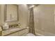 Simple bathroom with tub, shower, and granite countertop at 7741 Whitebridge Gln, University Park, FL 34201