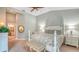 Bright bedroom with king-size bed and ensuite bathroom access at 7741 Whitebridge Gln, University Park, FL 34201