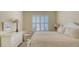 Guest bedroom with a queen-size bed and built-in dresser at 7741 Whitebridge Gln, University Park, FL 34201