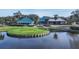Community clubhouse with water views and a putting green at 7741 Whitebridge Gln, University Park, FL 34201