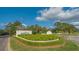 University Park community entrance with lush landscaping at 7741 Whitebridge Gln, University Park, FL 34201