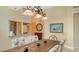 Bright dining room with a rustic wood table and coastal art at 7741 Whitebridge Gln, University Park, FL 34201