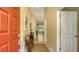 Bright entryway with a wooden bench and neutral colors at 7741 Whitebridge Gln, University Park, FL 34201