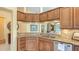 Modern kitchen with granite countertops, stainless steel appliances, and a breakfast bar at 7741 Whitebridge Gln, University Park, FL 34201