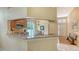 Modern kitchen with granite countertops, stainless steel appliances, and breakfast bar at 7741 Whitebridge Gln, University Park, FL 34201