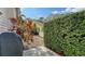 Cozy patio area with grill and lush greenery at 7741 Whitebridge Gln, University Park, FL 34201