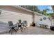 Small patio with seating area and decorative wall art at 7741 Whitebridge Gln, University Park, FL 34201