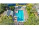 Resort-style pool and spa surrounded by lush landscaping at 7741 Whitebridge Gln, University Park, FL 34201