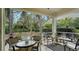 Relaxing screened porch with patio furniture at 7741 Whitebridge Gln, University Park, FL 34201