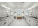 Spa-like bathroom with double vanity, marble flooring and a soaking tub at 8358 Redonda Loop, Lakewood Ranch, FL 34202