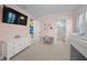 Pink bedroom with a built-in bunk bed and en-suite bathroom at 8358 Redonda Loop, Lakewood Ranch, FL 34202