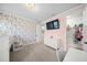 bedroom with floral wallpaper and a built in bunk bed at 8358 Redonda Loop, Lakewood Ranch, FL 34202