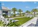 Landscaped lawn with lounge chairs near pool at 8358 Redonda Loop, Lakewood Ranch, FL 34202
