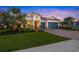 Beautiful two-story house with a three-car garage and nicely landscaped lawn at 8358 Redonda Loop, Lakewood Ranch, FL 34202