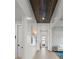 Bright hallway with shiplap walls and wood ceiling at 8358 Redonda Loop, Lakewood Ranch, FL 34202