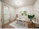 Bright home office features wood-look floors, white walls, and a stylish workspace at 8358 Redonda Loop, Lakewood Ranch, FL 34202