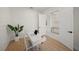 Home office with wood-look floors and white walls, offering a bright workspace at 8358 Redonda Loop, Lakewood Ranch, FL 34202