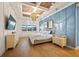 Spacious main bedroom with wall-mounted TV and a king-size bed at 8358 Redonda Loop, Lakewood Ranch, FL 34202