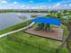 playground with shade structure near lake at 8358 Redonda Loop, Lakewood Ranch, FL 34202