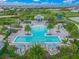 Community pool with lounge chairs and cabanas at 8358 Redonda Loop, Lakewood Ranch, FL 34202