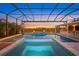 Resort-style pool and spa with a covered lanai and beautiful sunset views at 8358 Redonda Loop, Bradenton, FL 34202