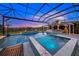 Luxury pool and spa with a covered lanai and breathtaking sunset views at 8358 Redonda Loop, Lakewood Ranch, FL 34202