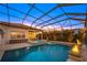 Luxury pool with spa, screened enclosure, and fire pit at 8358 Redonda Loop, Lakewood Ranch, FL 34202