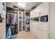 Well-organized walk-in closets with custom shelving and drawers at 8358 Redonda Loop, Lakewood Ranch, FL 34202