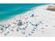 Beachfront property with many people enjoying the day at 9397 Midnight Pass Rd # 404, Sarasota, FL 34242