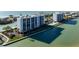 Waterfront condo community with a private pool and serene surroundings at 9397 Midnight Pass Rd # 404, Sarasota, FL 34242