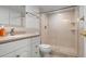 Clean bathroom with a large shower and updated vanity at 9397 Midnight Pass Rd # 404, Sarasota, FL 34242