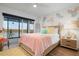 Bright bedroom with water views and coastal decor at 9397 Midnight Pass Rd # 404, Sarasota, FL 34242