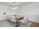 Elegant dining room with modern light fixture at 9397 Midnight Pass Rd # 404, Sarasota, FL 34242