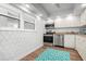 Modern kitchen, stainless steel appliances, white cabinets at 9397 Midnight Pass Rd # 404, Sarasota, FL 34242