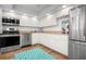 White cabinets, granite countertops, stainless steel appliances at 9397 Midnight Pass Rd # 404, Sarasota, FL 34242