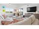 Living room with sectional sofa and water views at 9397 Midnight Pass Rd # 404, Sarasota, FL 34242
