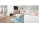 Living area with sectional sofa and wood floors at 9397 Midnight Pass Rd # 404, Sarasota, FL 34242