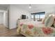 Main bedroom with water view and sliding glass doors at 9397 Midnight Pass Rd # 404, Sarasota, FL 34242