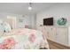 Bedroom with coastal decor and large dresser at 9397 Midnight Pass Rd # 404, Sarasota, FL 34242