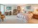 Spacious bedroom with water views and sitting area at 988 Blvd Of The Arts # 1512, Sarasota, FL 34236