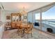 Elegant dining room with water views and a chandelier at 988 Blvd Of The Arts # 1512, Sarasota, FL 34236